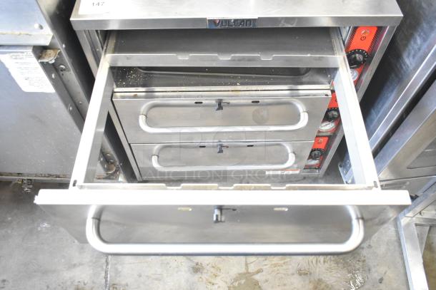 2017 Vulcan VW3S commercial 3-drawer warming drawer in stainless steel. Features control knobs, operates on 120 volts, 1 phase.