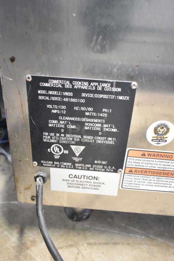 Vulcan VW3S Commercial 3 Drawer Warming Drawer, 120V, 1 Phase. Features metal label indicating model, serial, and safety warnings.