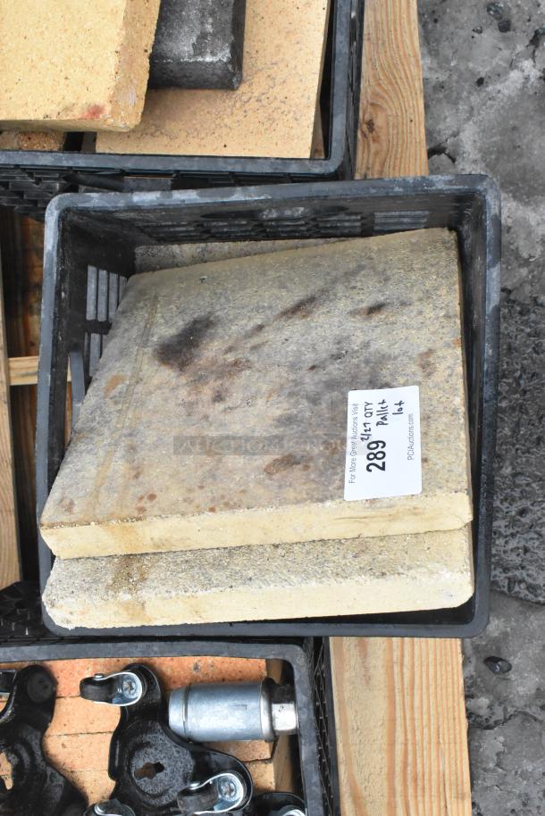 Pallet lot including pizza oven cooking stones, metal legs, and hardware items. Tag indicates item 289 lot M64.