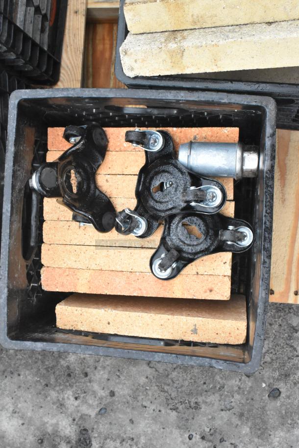 Pallet lot containing cooking stones for pizza oven, black metal legs, and assorted items. Items appear used.