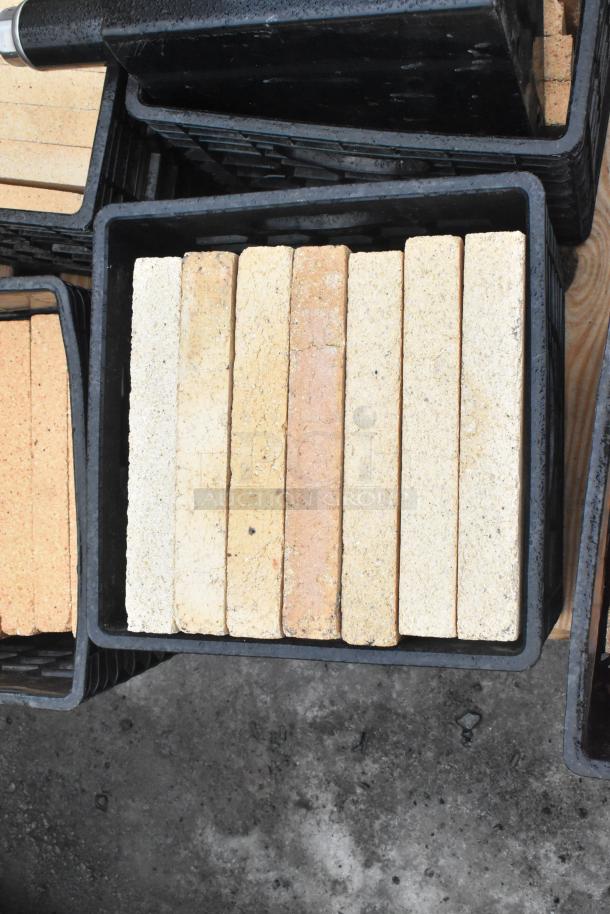 Pallet lot including cooking stones for pizza oven, arranged in crates. Ideal for outdoor cooking setups.