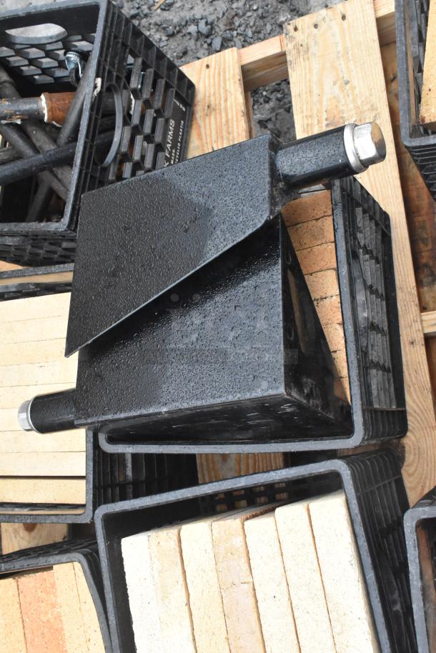 Pallet with cooking stones and metal legs, various items, in good condition. Includes crates for storage.