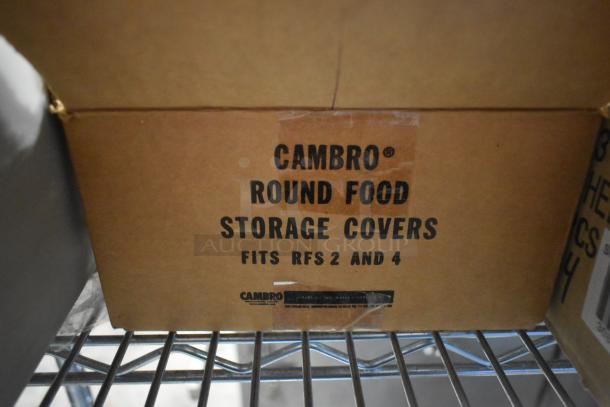 Brown cardboard box labeled "CAMBRO Round Food Storage Covers Fits RFS 2 and 4," part of a 12-item new lot.