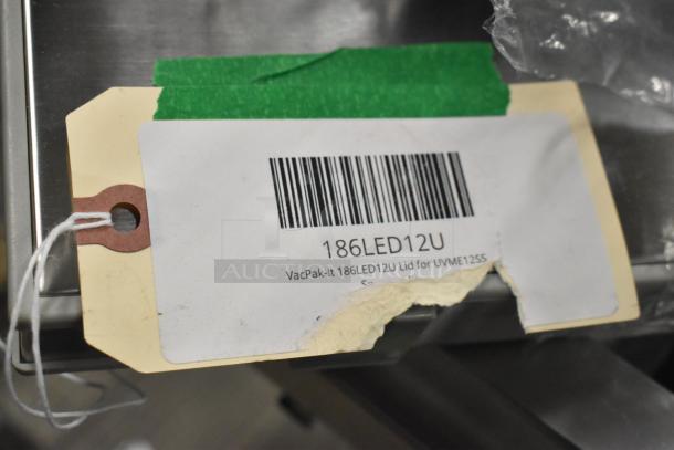 New VacPak-It 186LED12U Lid for UVME12SS, tag with barcode and product details, part of 5 brand new items auction.