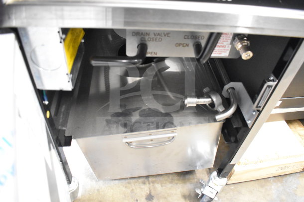 2025 Henny Penny 500 pressure fryer with drain valve, on commercial casters, 208V, 3-phase, in good condition.
