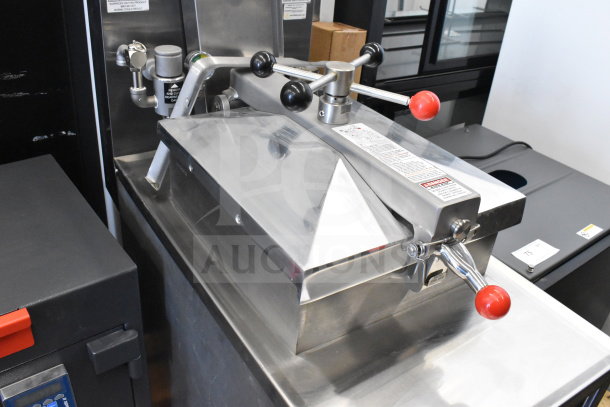 2025 Henny Penny 500 electric pressure fryer on casters, 208V, 3 phase, stainless steel, excellent condition with safety labels.