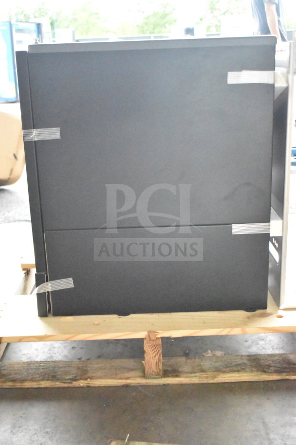 Brand new Follett ID50 commercial ice machine head, visible scratch and dent, black finish, compact design.