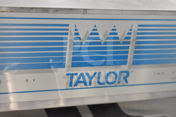 Taylor 794-27 commercial soft serve ice cream machine, featuring water cooling, 2 flavors with twist, 208-230V, 1 phase.
