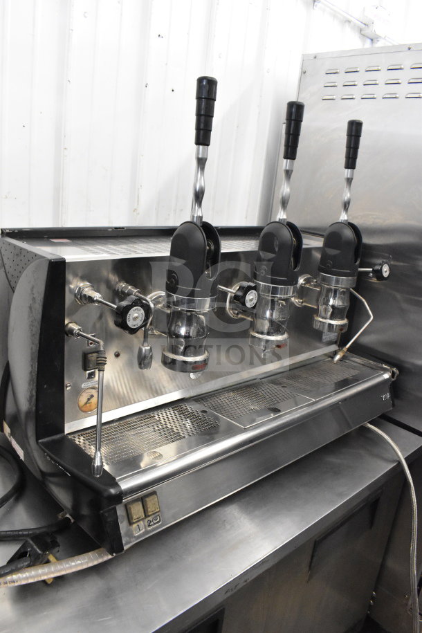Vela commercial countertop 3 group espresso machine with 2 steam wands, stainless steel, in used condition.