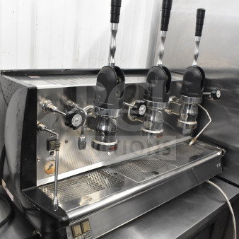 Vela commercial countertop 3 group espresso machine with 2 steam wands, stainless steel, in used condition.