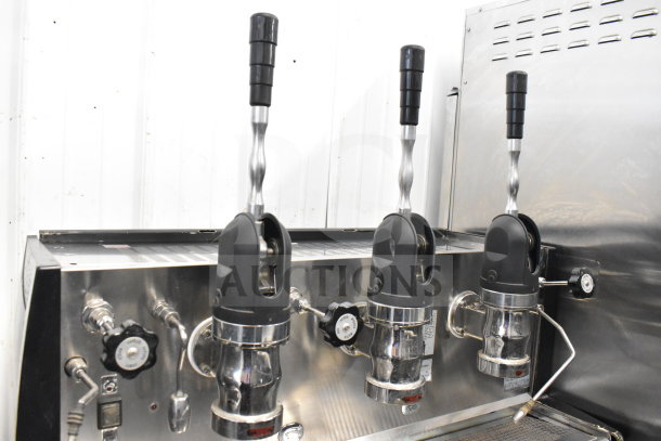 Vela Commercial 3 Group Espresso Machine, stainless steel, two steam wands, excellent condition, industrial kitchen use.