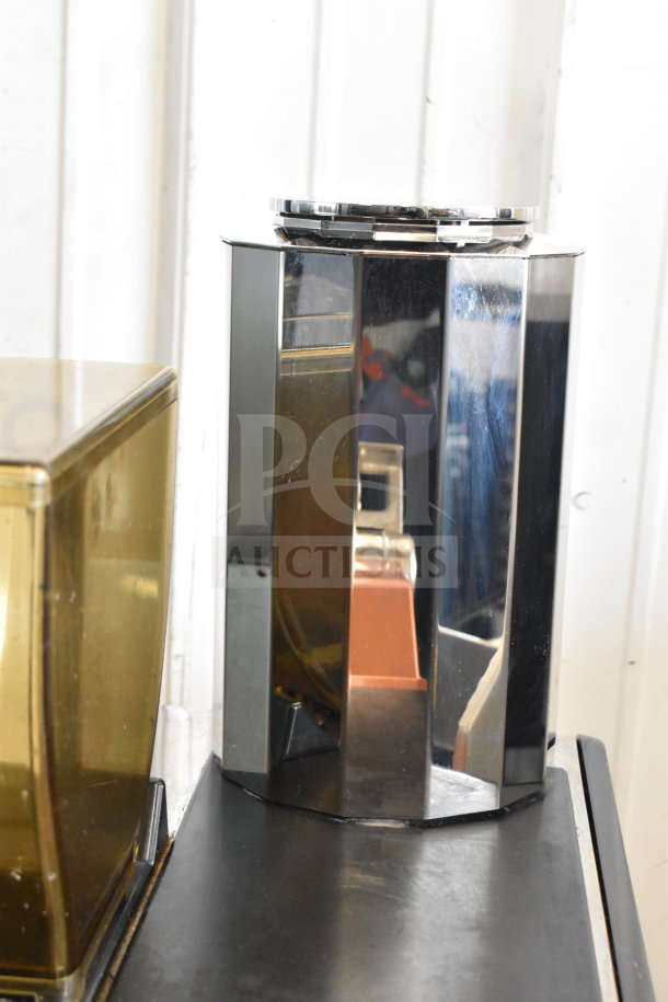 2019 Thermoplan Mastrena M2-CS espresso machine in stainless steel, with hoppers and steam wand, LCD display visible.