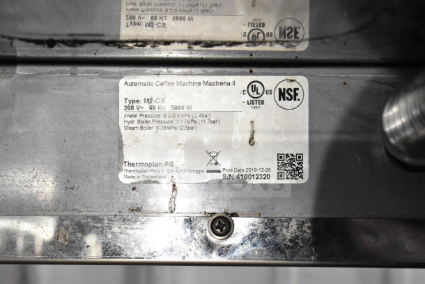 2019 Thermoplan Mastrena M2-CS espresso machine label, stainless steel, 208V, 1 Phase, NSF certified, made in Switzerland.