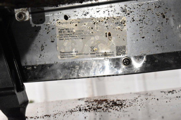 2022 Thermoplan Mastrena M2-CS espresso machine label, stainless steel, displays make, model, and technical specs.