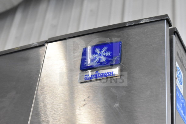 Manitowoc SD0452A ice head on SPA310 dispenser, stainless steel, 115V, 1 phase. Features blue logo and snowflake design.