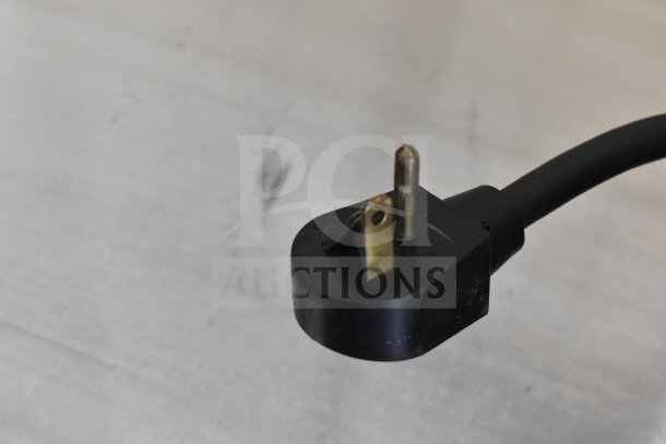 Close-up of a power plug for a Glastender KC60-L1-BSH kegerator, showing three-prong connection.