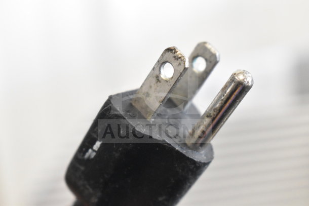 Plug of Bizerba VS12 Commercial Countertop Slicer, 120V, 1 Phase. Close-up showing standard prongs.