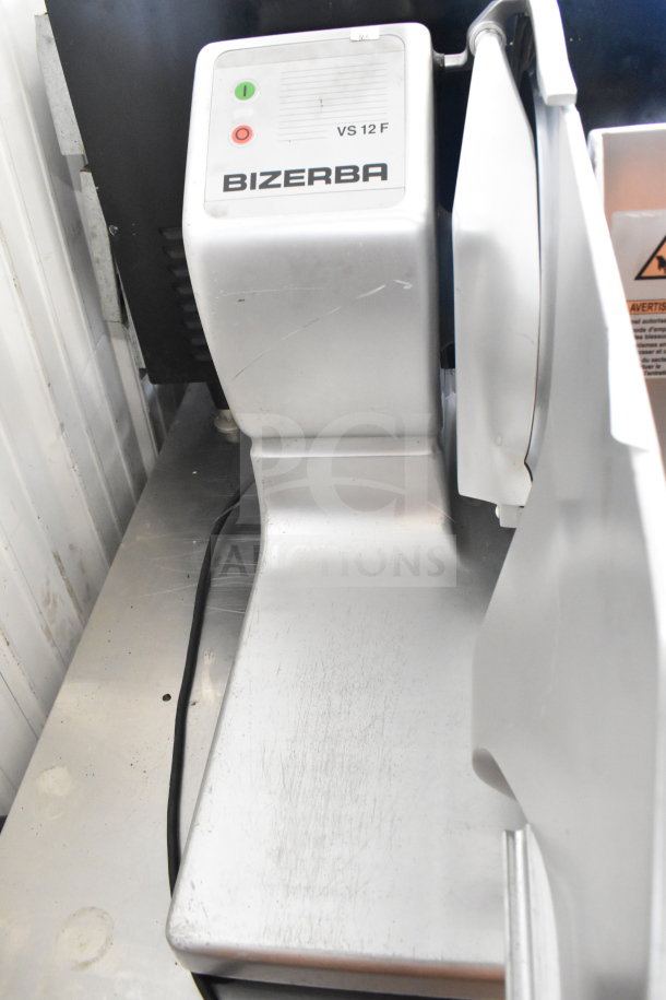 2023 Bizerba VS12 commercial countertop slicer, 120V, 1 phase. Slight surface wear, visible controls, model VS12 label.
