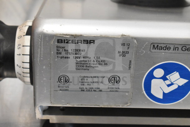 2023 Bizerba VS12 commercial slicer, 120V, 1 phase, with visible model and certification labels.