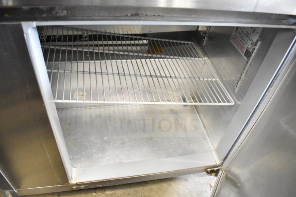 Continental SW60 2 Door Undercounter Cooler, stainless steel, interior shelf, 115 volts, 1 phase, visible markings.