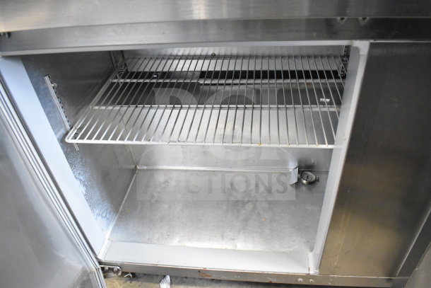 Continental SW60 commercial undercounter cooler with two doors, shelf, and internal thermometer. 115 volts, 1 phase. Visible wear.
