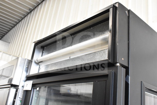 True GEM-23 Commercial Single Door Reach In Cooler Merchandiser, 115V, shown with glass door and black exterior.