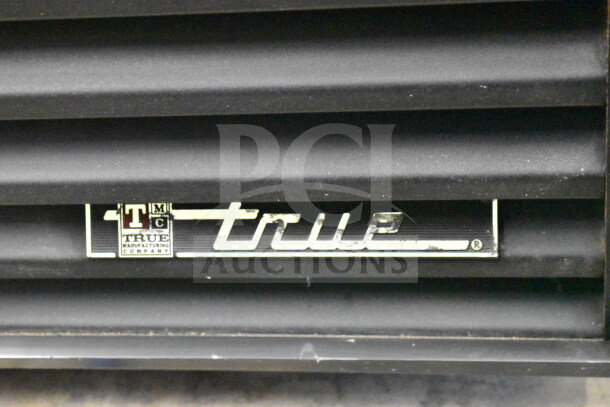True GEM-23 commercial cooler label, featuring brand logo. Model GEM-23, 115 volts, single phase, reach-in design.