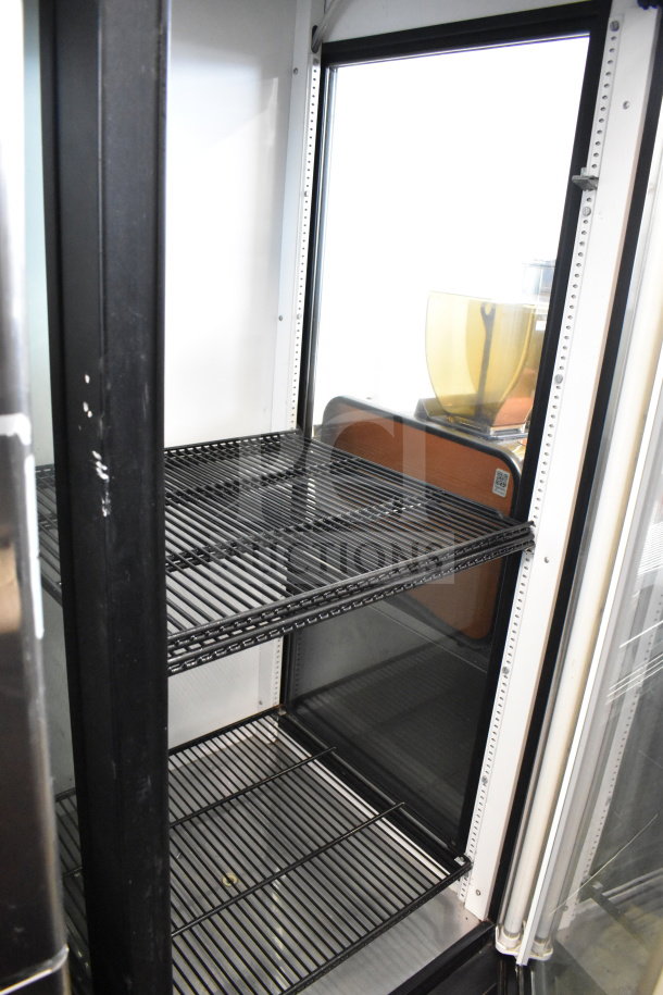 True GEM-23 commercial single door reach-in cooler merchandiser. Features adjustable shelves and clear glass door. 115V, 1 phase.