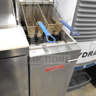 Vulcan LG400-1 commercial deep fat fryer, natural gas, 120,000 BTU, durable stainless steel, dual baskets, gently used condition.