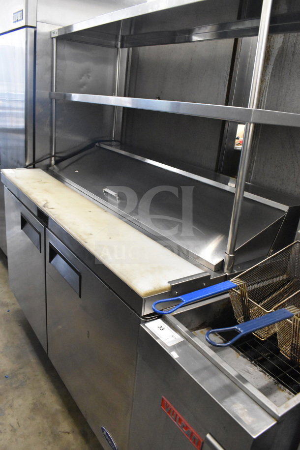 2021 Atosa MSF8303GR commercial sandwich salad prep table with 2 overshelves, stainless steel, 115V, shown with white cutting board.