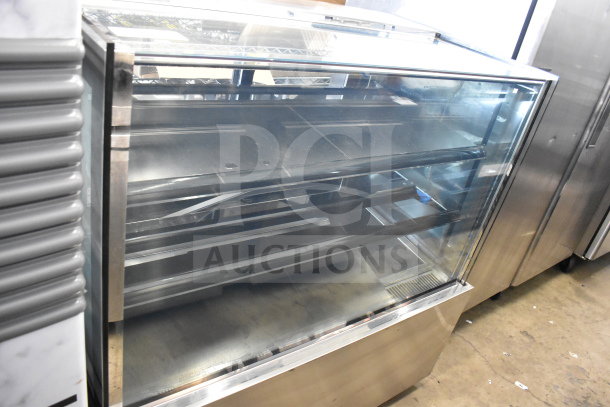 Yukon commercial deli display case with glass front, stainless steel shelves, 115 volts, 1 phase, excellent condition.