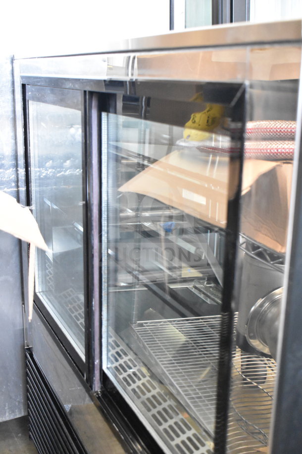 Yukon Commercial Deli Display Case, floor style, glass front, 115 volts, 1 phase. Clean condition, ideal for merchandising.