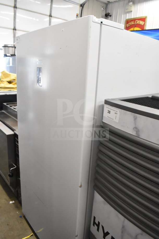 Midea Single Door Reach In refrigerator, 115 volts, 1 phase, white exterior, minor surface wear visible on doors.