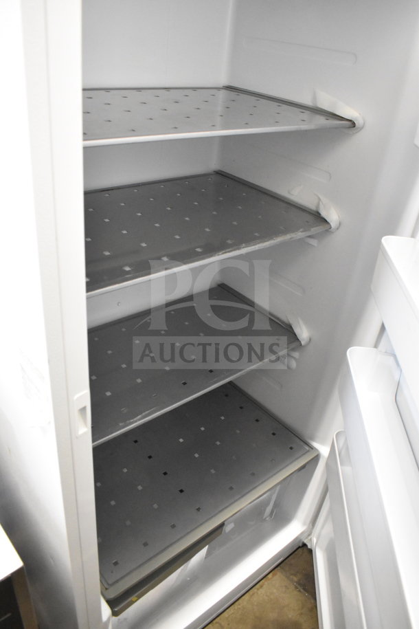 Midea single door reach-in refrigerator, 115 volts, 1 phase, features adjustable shelves, clean interior, excellent condition.