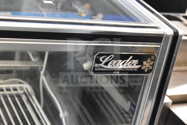 2017 Leader CBK57 S/C Deli Display Case, commercial floor style, 115 volts, 1 phase, showcasing interior shelves, label visible.