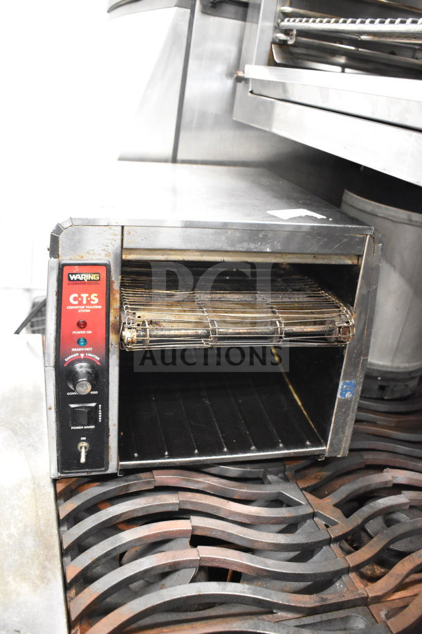 Waring CTS1000 commercial conveyor toaster oven, electric, 120V, used condition with visible wear on exterior, model CTS1000.