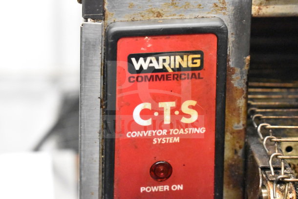 Waring CTS1000 commercial conveyor toaster oven, worn condition, visible labels indicating model and power status, 120 volts.