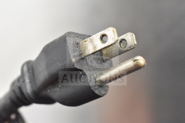 Close-up of the plug for Waring CTS1000 commercial toaster oven, showing slight wear, compatible with 120 volts, 1 phase.