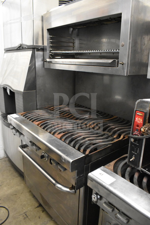 Jade Range commercial gas-powered 6-burner range with salamander cheese melter, stainless steel, in used condition.