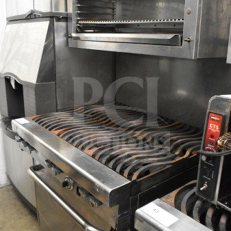 Jade Range commercial gas-powered 6-burner range with salamander cheese melter, stainless steel, in used condition.