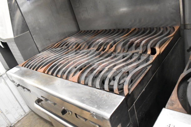 Jade Range commercial gas-powered 6-burner stove with salamander cheese melter, used condition, steel construction.