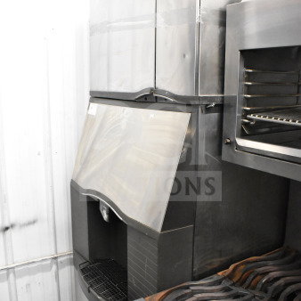 Manitowoc SD0452A ice head on SPA310 dispenser. Stainless steel, 115V, 1 phase. Used condition, visible Manitowoc branding.