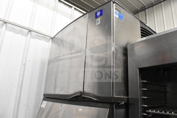 Manitowoc SD0452A ice head on SPA310 dispenser, commercial, stainless steel, 115V, 1 phase, visible labels and QR code.