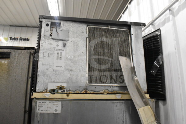 Manitowoc SD0452A ice maker on SPA310 dispenser, commercial-grade, 115V, 1 phase, visible model and serial labels.