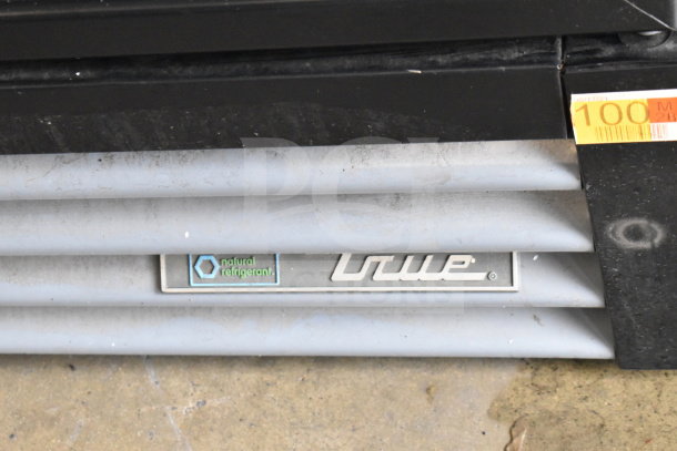 2020 True GDM-12-HC merchandiser cooler panel with "natural refrigerant" label, showing brand name.