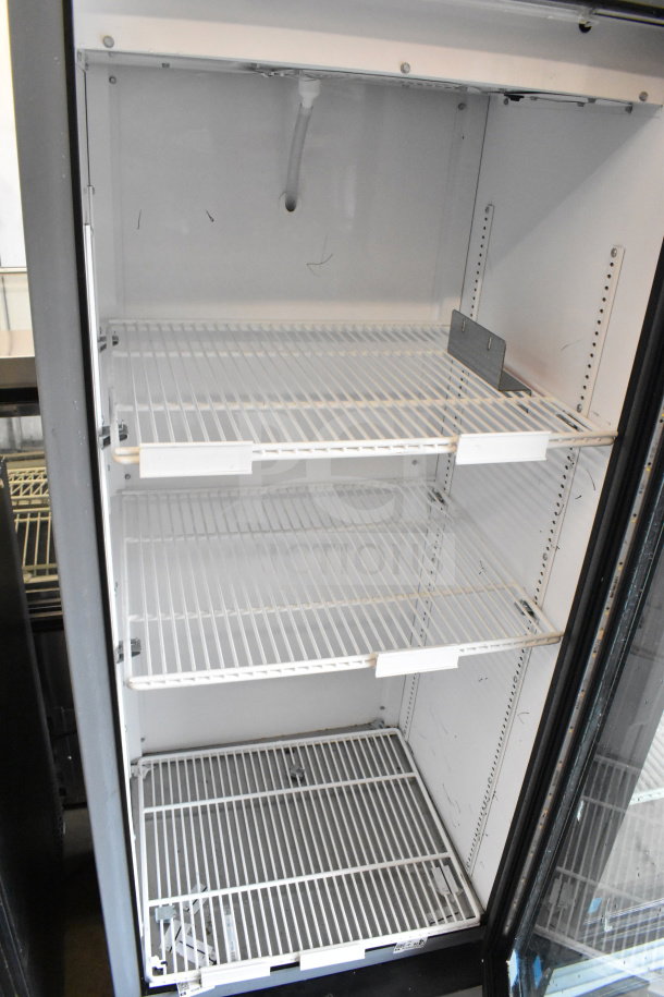 2020 True GDM-12-HC commercial cooler, single glass door, three wire shelves, 115 volts, clean interior, good condition.