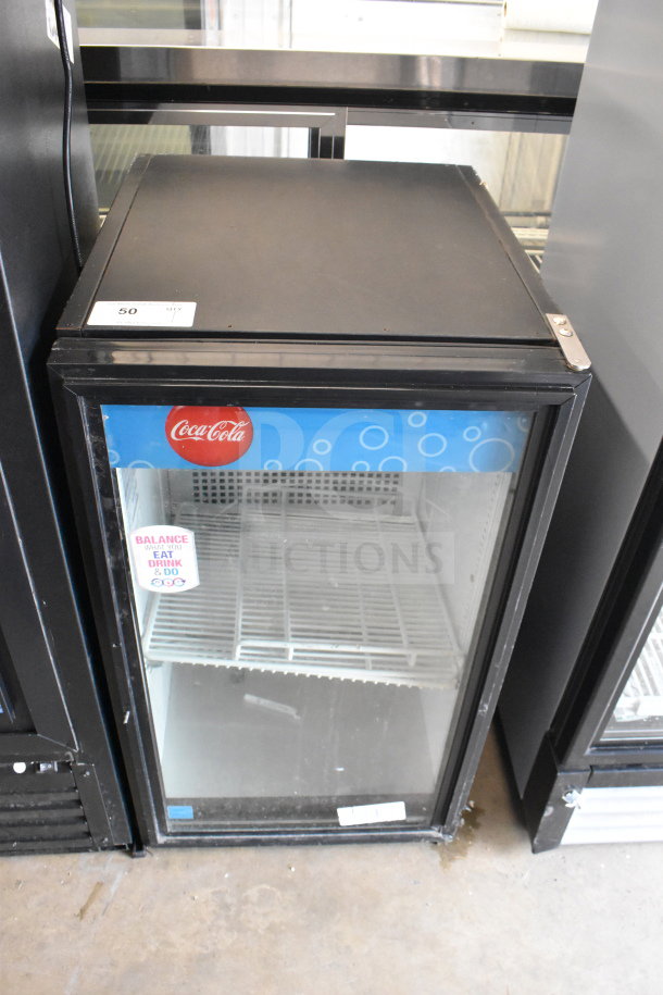True GDM-06-LD Mini Cooler Merchandiser, commercial single door, black frame, Coca-Cola branding, 115V, used condition.