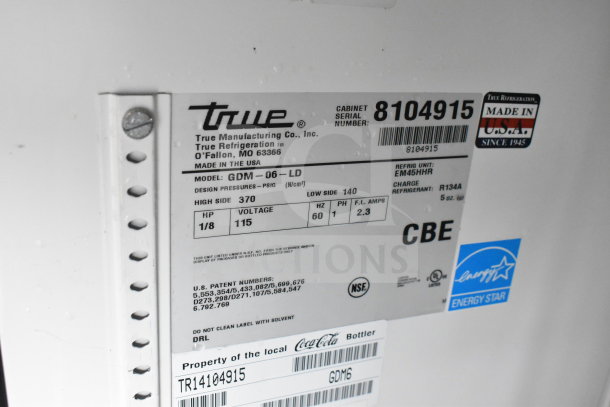True GDM-06-LD mini cooler label showing model, voltage 115V, 1 Phase, refrigerant R134A, and NSF certification.