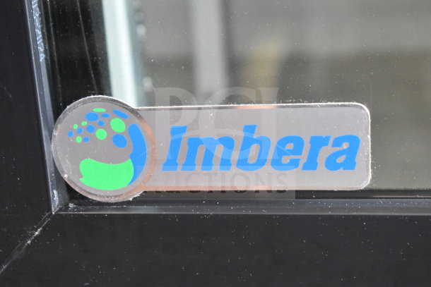 Imbera VRD41 logo on glass door of commercial 2-door cooler merchandiser. Visible brand marking.
