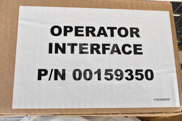Cardboard box labeled "Operator Interface" with part number 00159350, indicating it is brand new with scratches and dents.